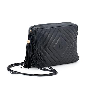 599. CHANEL,a black leather shoulderbag.