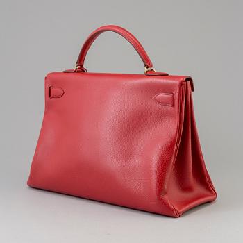 A red Epson "Kelly 40" bag by Hermès 1991.