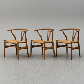 Three armchairs, 'Wishbone Chair' by Hans J Wegner, Carl Hansen & Son, Odense, Denmark.