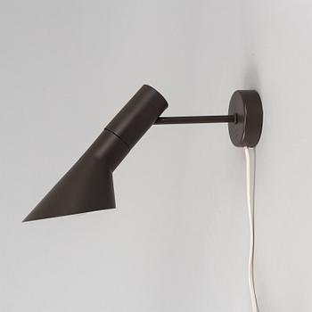 Arne Jacobsen, a black lacquered 1950/60's wall light by Axel Annell on license from Louis Poulsen.