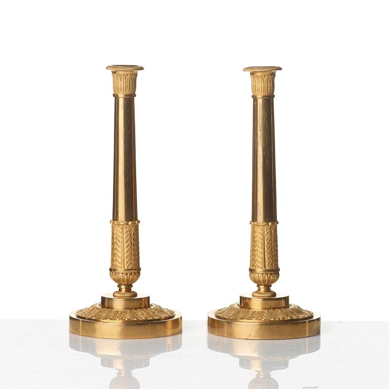 A pair of Empire early 19th century gilt bronze three-light candelabra.