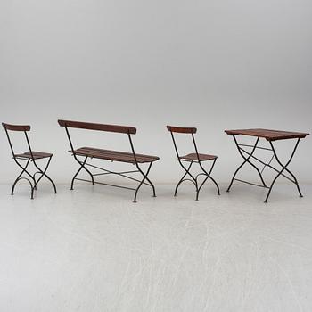 A garden sofa, table and a pair of chairs, first half of the 20th century.