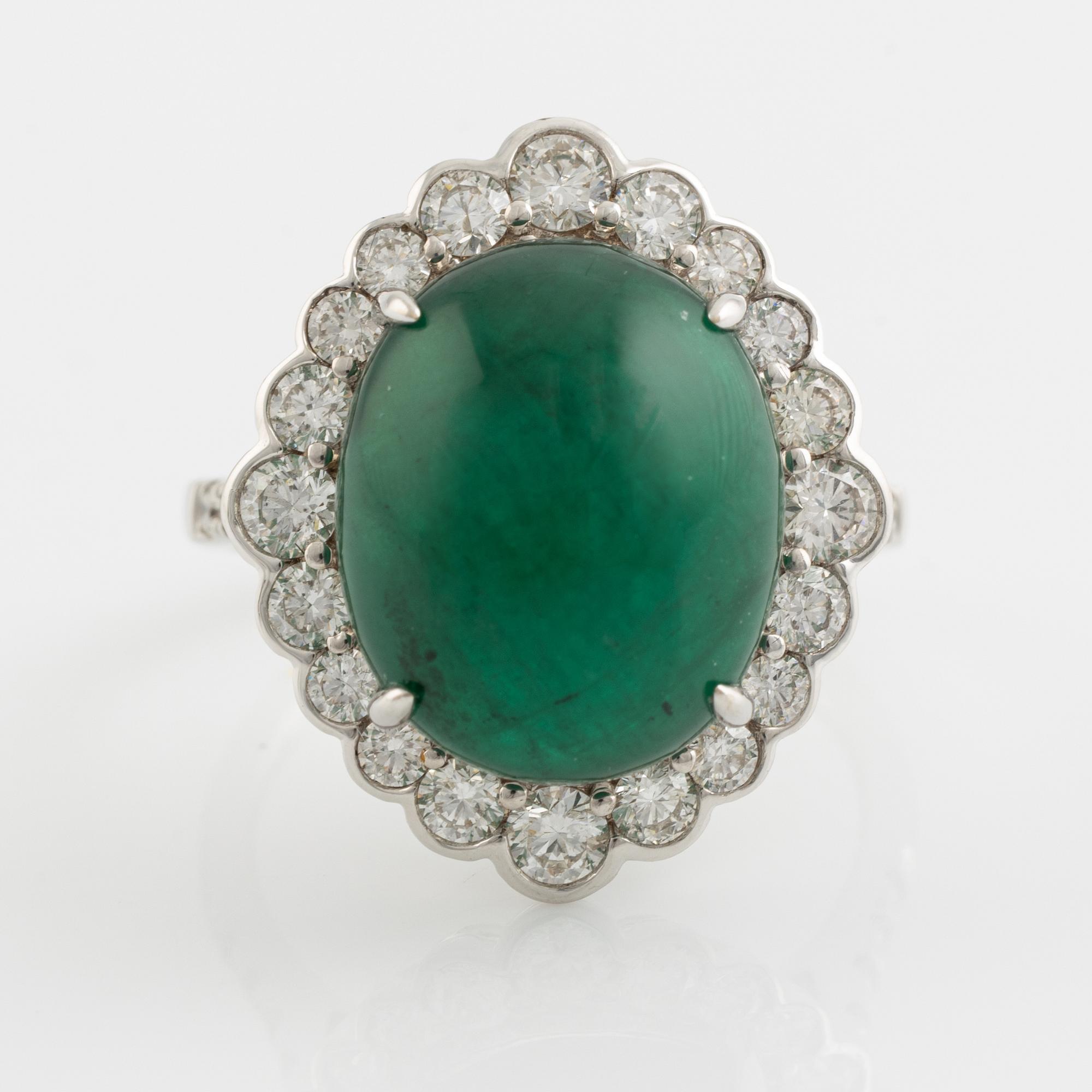 Cabochon cut emerald and brilliant cut diamond ring.