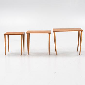 A teak and oak nesting table, 1950s.