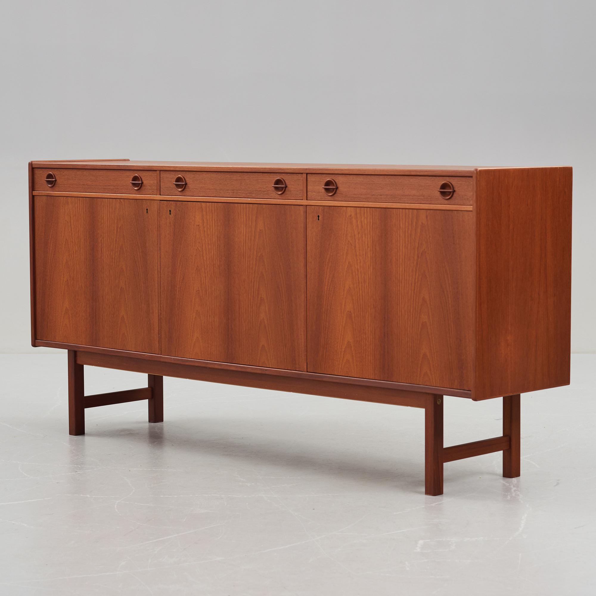 A late 20th Century teak veneered sideboard.