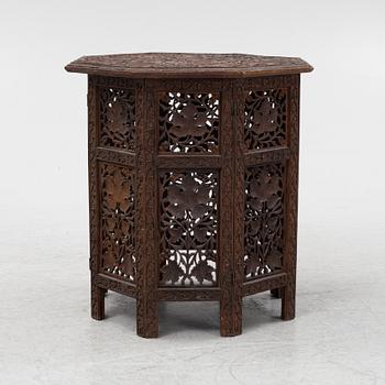 A carved table, first half of the 20th Century.