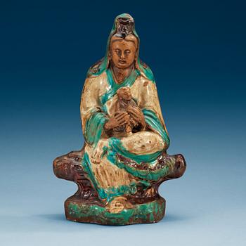 A turquoise, aubergine and white glazed figure of Guanyin, Ming dynasty (1368-1644).