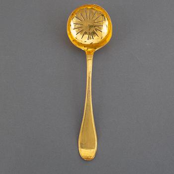 A Swedish 18th century gilt-metal caster-spoon.