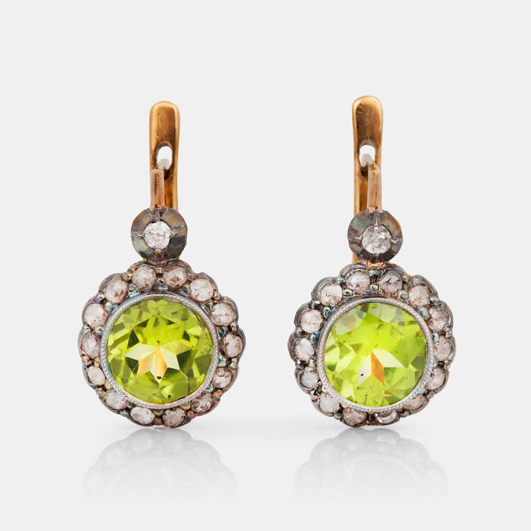 A pair of earrings with peridots and diamonds, Russia 1899-1908.