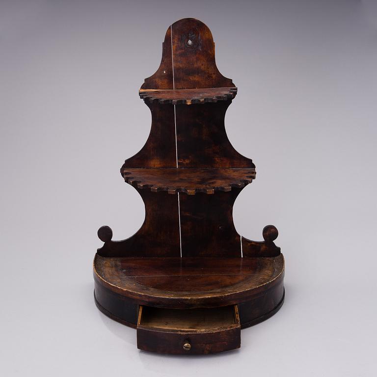 19th century pipes on a wooden pipe rack.