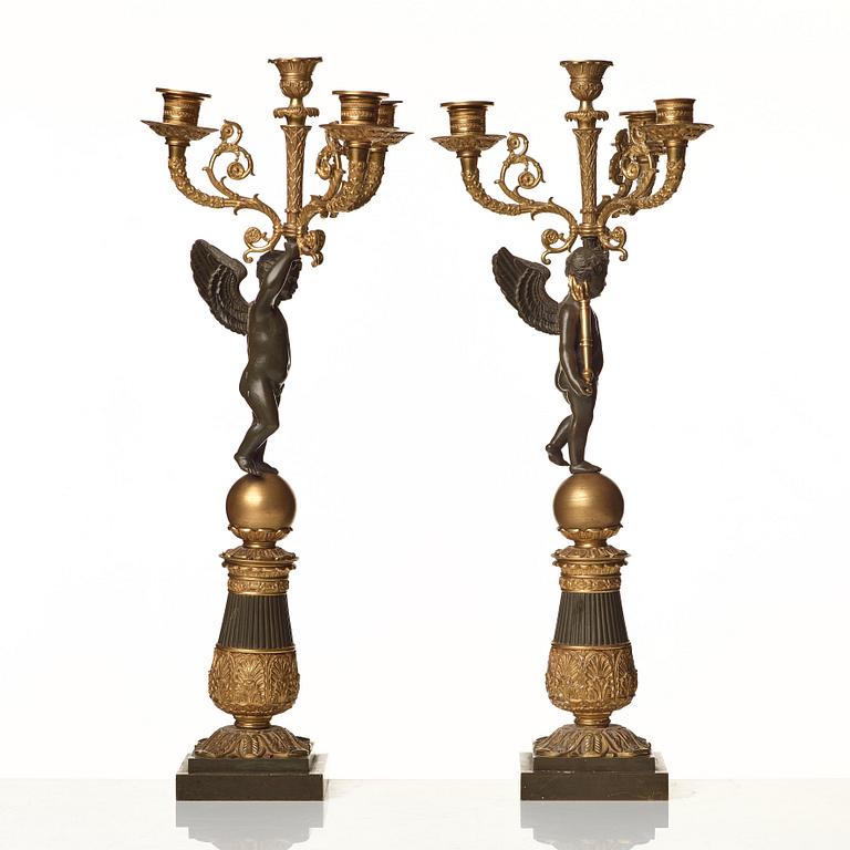 A pair of French Empire early 19th century four-light candelabra.