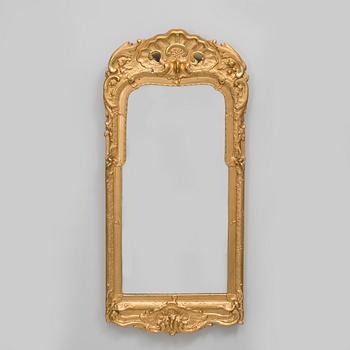 A rococo mirror, 18th century.