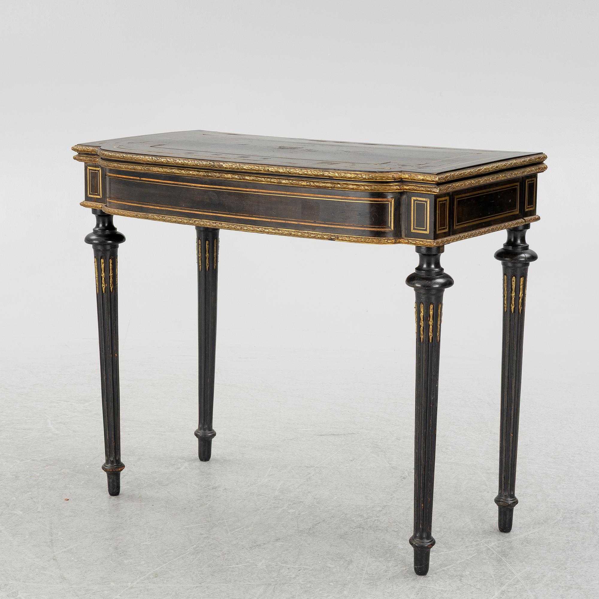A Louis XVI style games table, circa 1900.