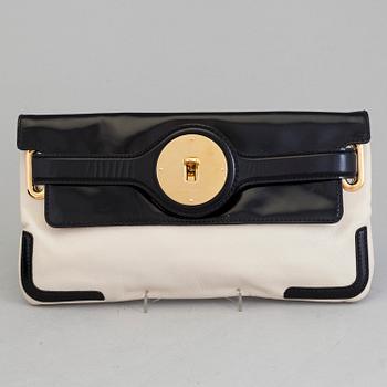 A black and white leather clutch by Balenciaga.