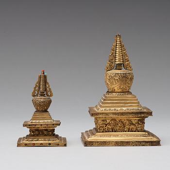 Two Tibetan gilt copper alloy stupa's, 19th Century.