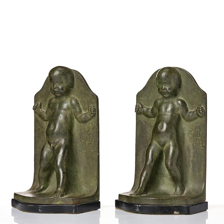 Axel Gute, a pair of green patinated metal bookends, Sweden, dated 1920.