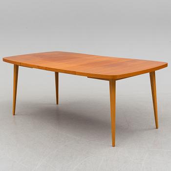 A 1950s teak and teak veneer table.