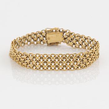 An 18K guld bracelet.