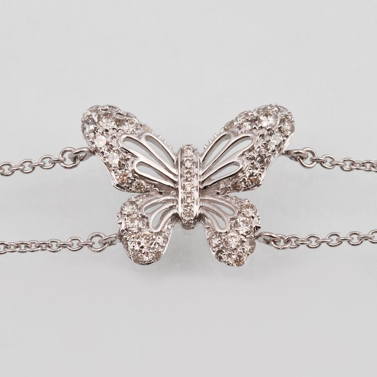 ARMBAND, 18K vitguld med briljantslipade diamanter ca 0.36 ct. Vikt 2,7 gram.