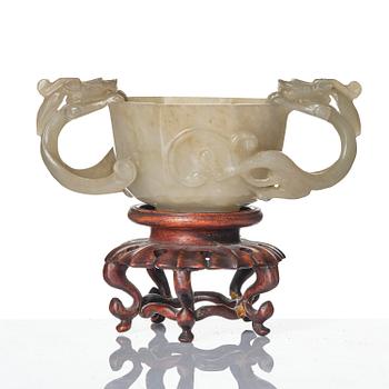 A carved nephrite cup with 'chilong' handles, late Qing dynasty/early 20th century.