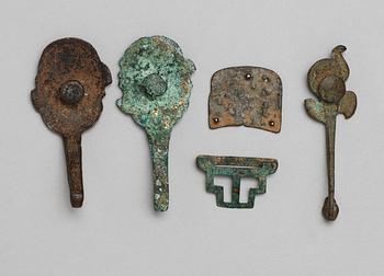 A set of four archaistic bronze garment hooks.
