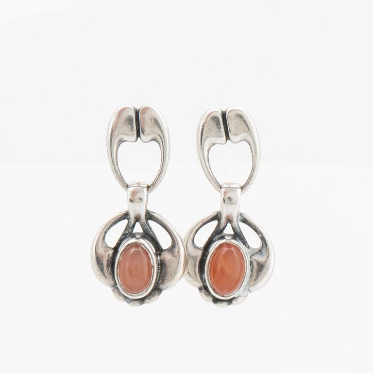 A silver and moonstone jewellery set consisting of necklace and earrings by Georg Jensen, jewellery of the year 2006.