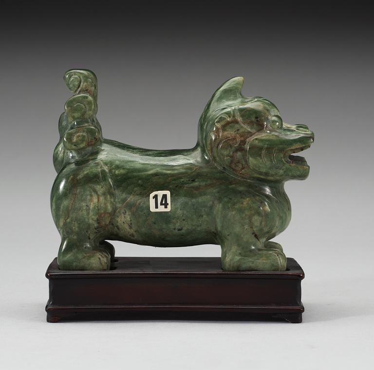 A nephrite figure of a Buddhist Lion, late Qing dynasty.