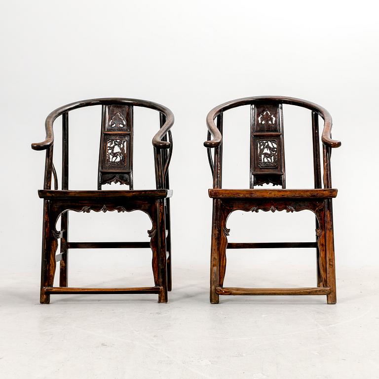 A pair of Chinese hardwood armchairs, circa 1900.