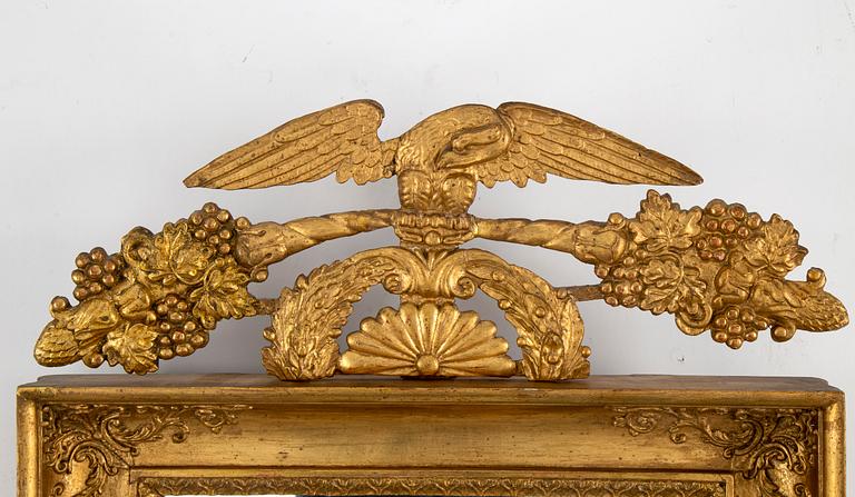 A first half of the 19th century mirror wall sconce.