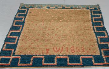A RYA BED COVER, possibly signed I W, dated 1823, ca 170-176,5 x 136,5-141,5 cm.