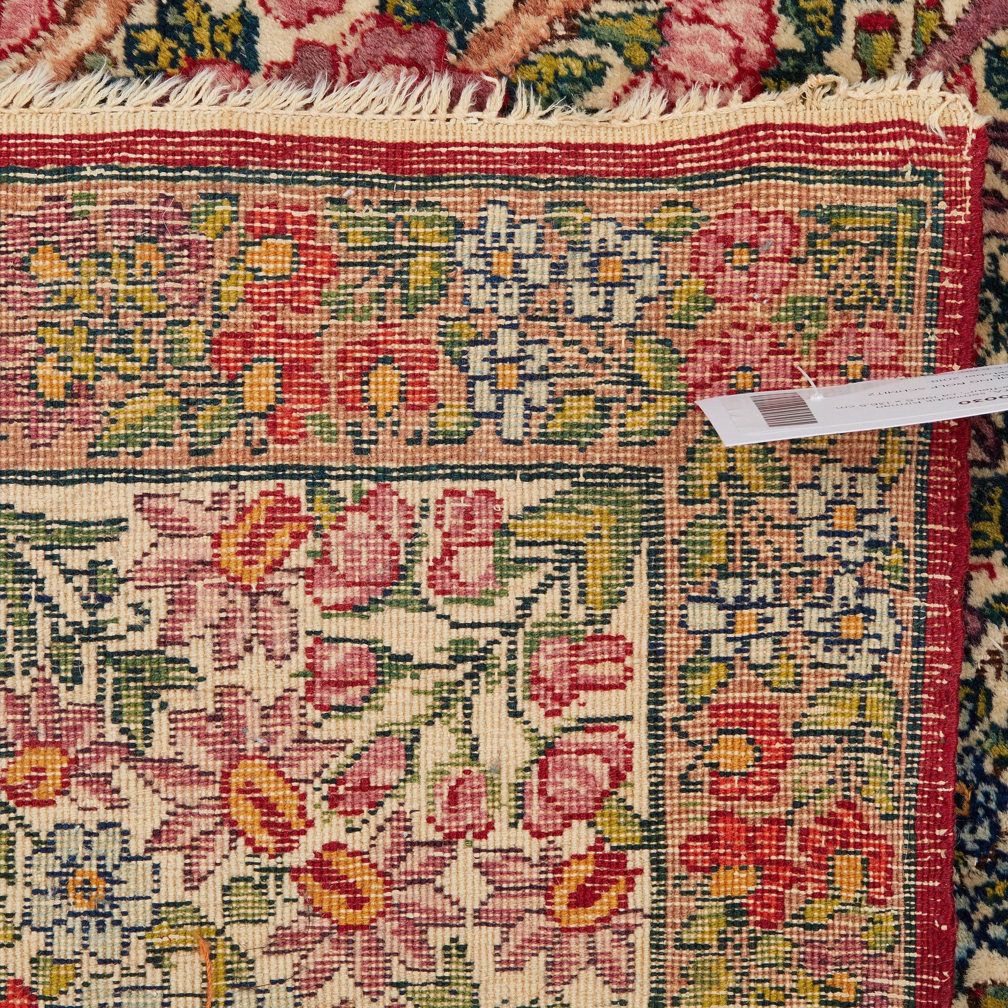 A RUG, a semi-antique Kerman "mille-fleur", ca 198,5 x 136,5 cm.