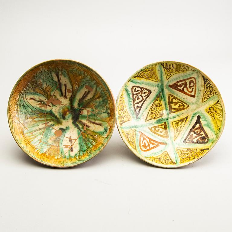 A group of Persian ceramics, some Nishapur-style Sgrafitto. (5 pieces).