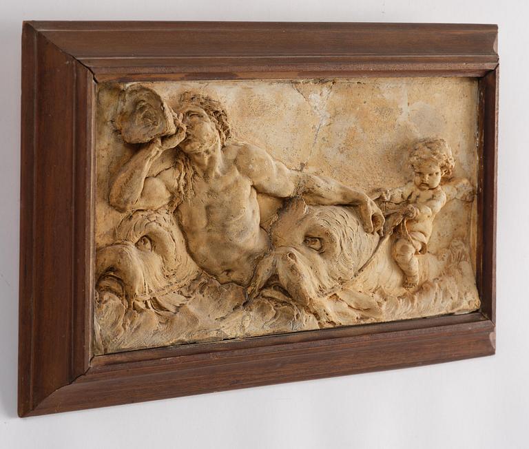 Claude Michel Clodion, attributed to, A relief depicting a nereid riding a dolphin alongside a triton blowing into a conch.