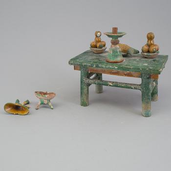 A group of eight chinese figures with three objects, earthenware, Ming dynasty.