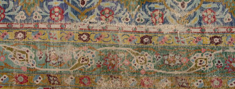 A PERSIAN CARPET. Early 20th century. Ca 687x470 cm.