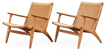 459. Two Hans J Wegner oak easy chairs, 'CH-25' Carl Hansen & Son, Denmark.