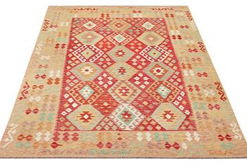 A Kelim carpet, c. 292 x 202 cm.