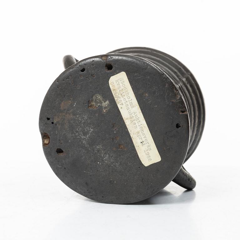 Mortar and pestle, dated 1673.