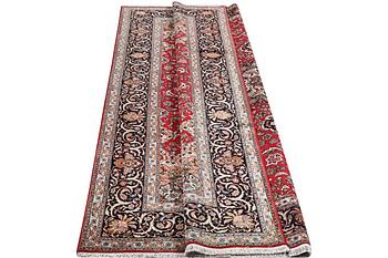 A Tabriz, 50RAJ, part silk carpet, c. 325 x 208 cm.