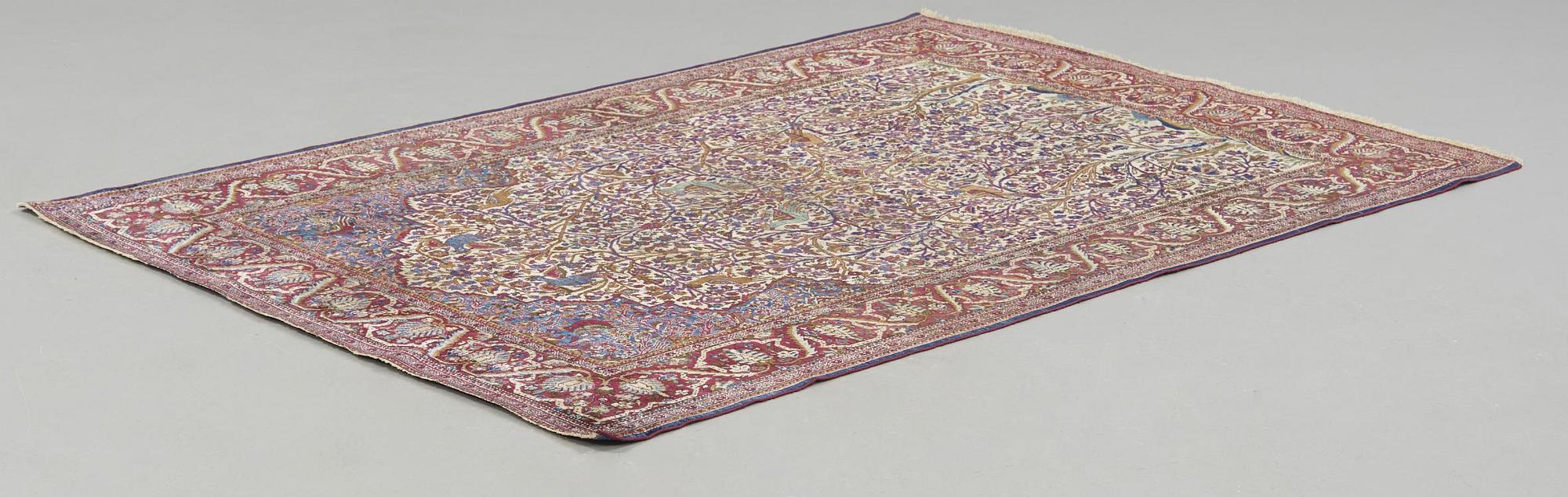 A CARPET, a semi-antique silk Kashan, ca 198,5 x 137 cm.