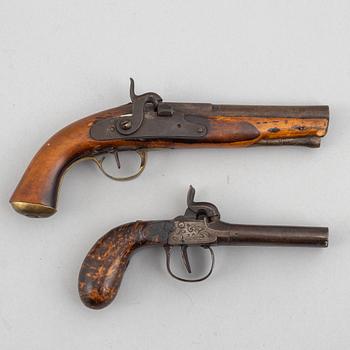 Two 19th century percussion pistols.