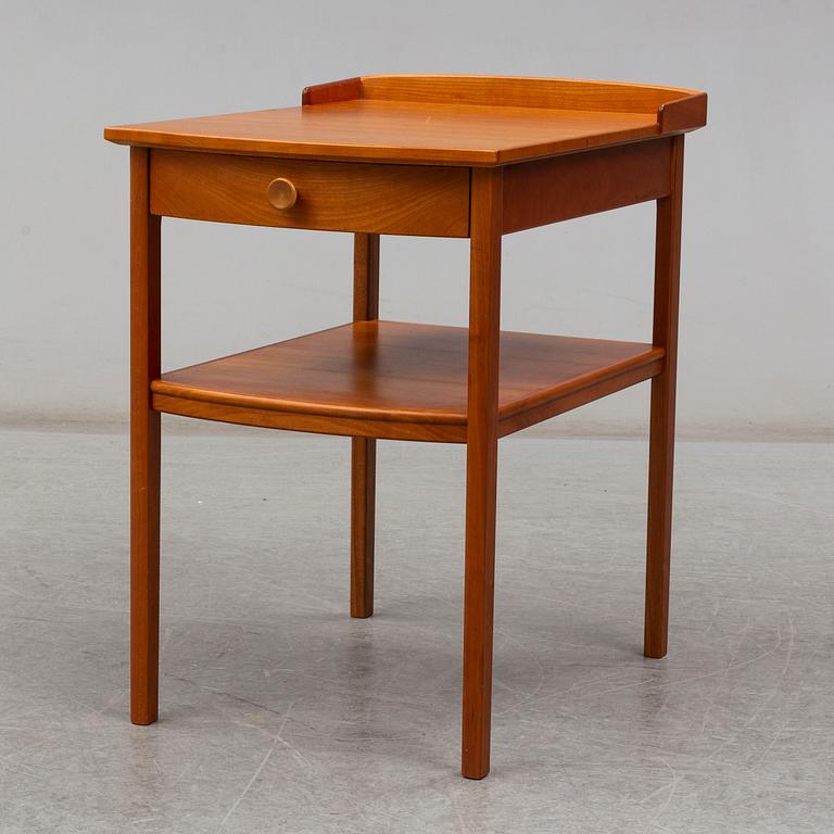 A Carl Malmsten head boards and bedside table, late 20th century.