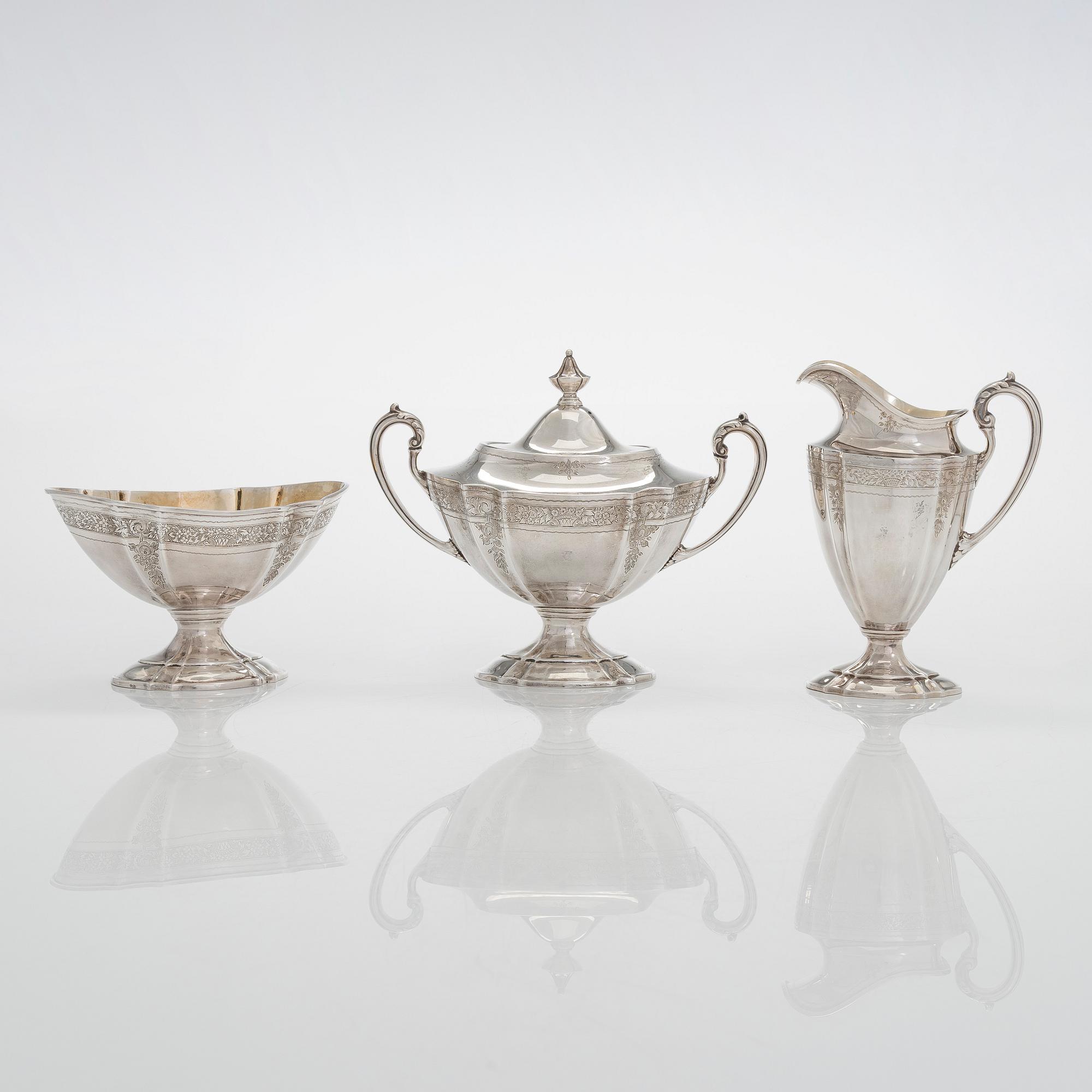A five-piece sterling silver coffee and tea service, and 12 spoons, USA, first quarter of the 20th century.