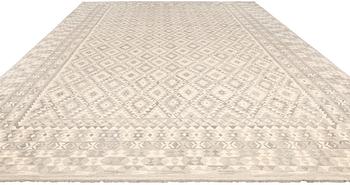 A kilim carpet, c 590 x 407 cm.