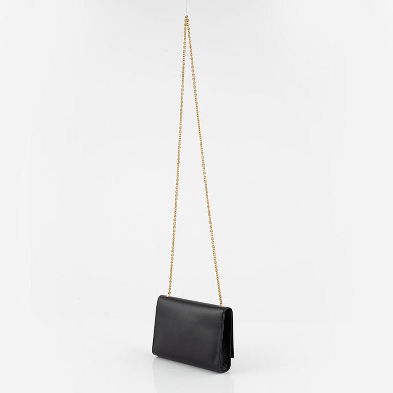 Salvatore Ferragamo, a black saffiano leather crossbody bag.