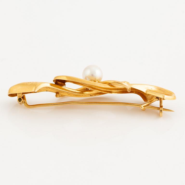 Brooch 18K gold with a cultured pearl.