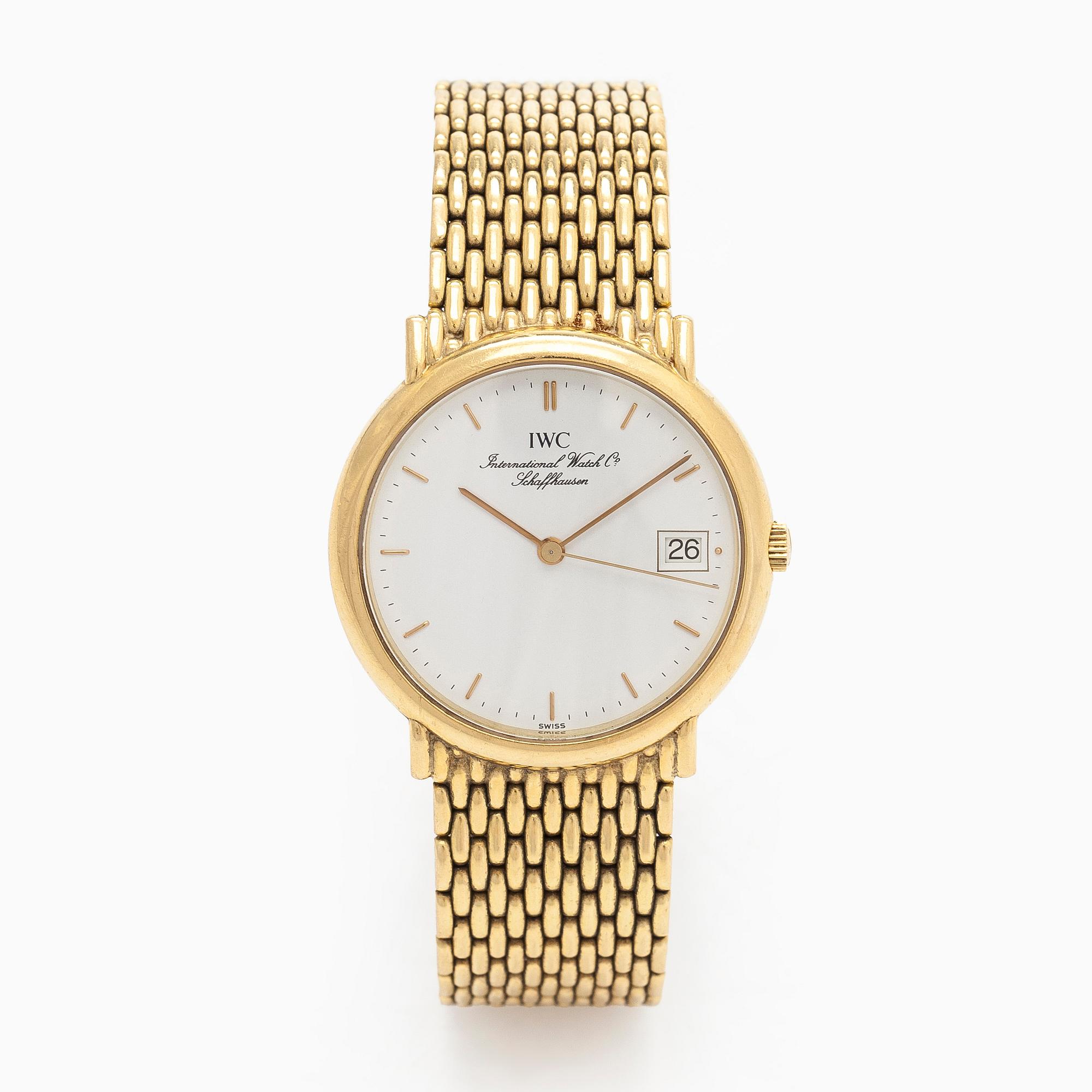 IWC (International Watch Co.), 31 mm, 18K gold, quartz.