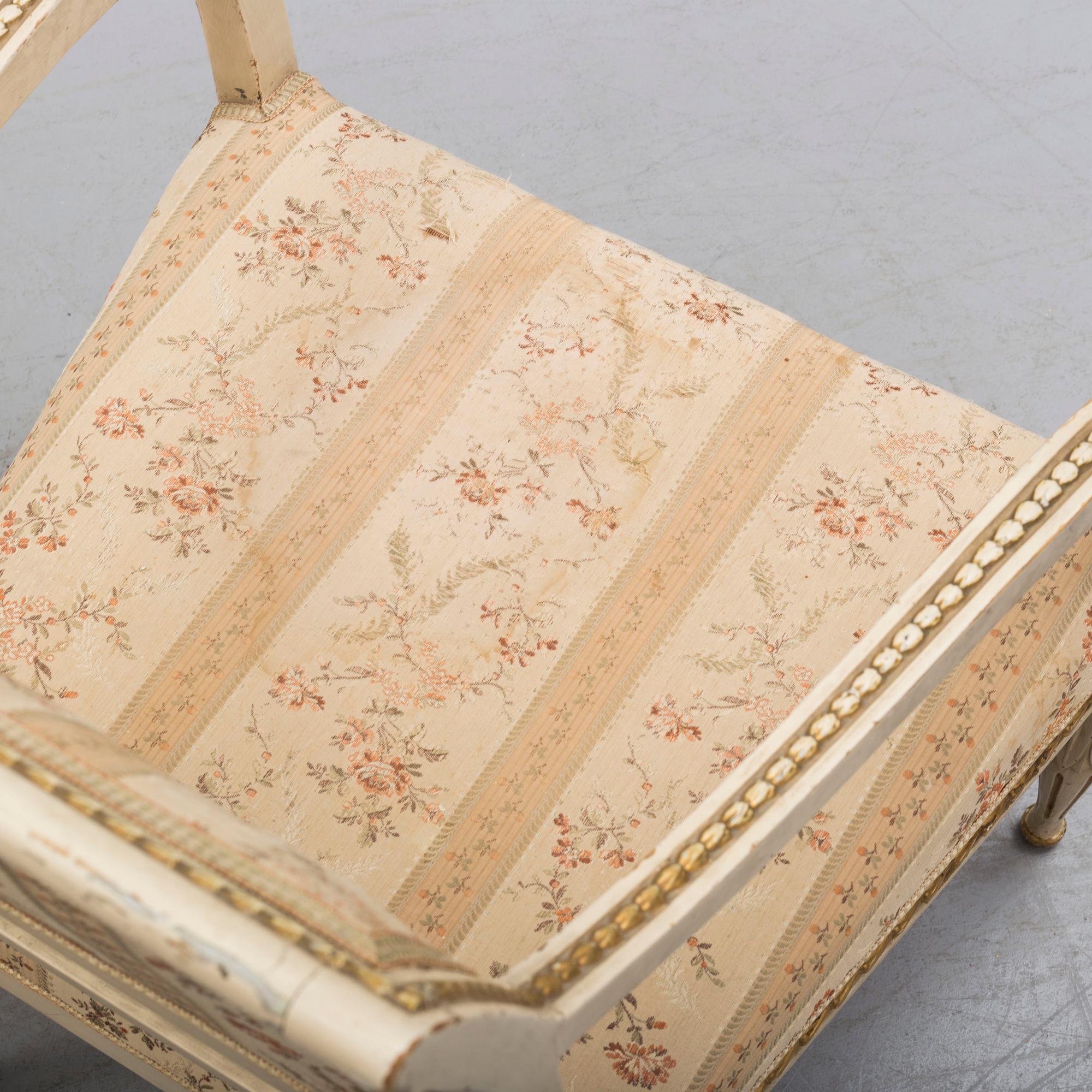 A pair of first half of the 19th century Empire arm chairs.