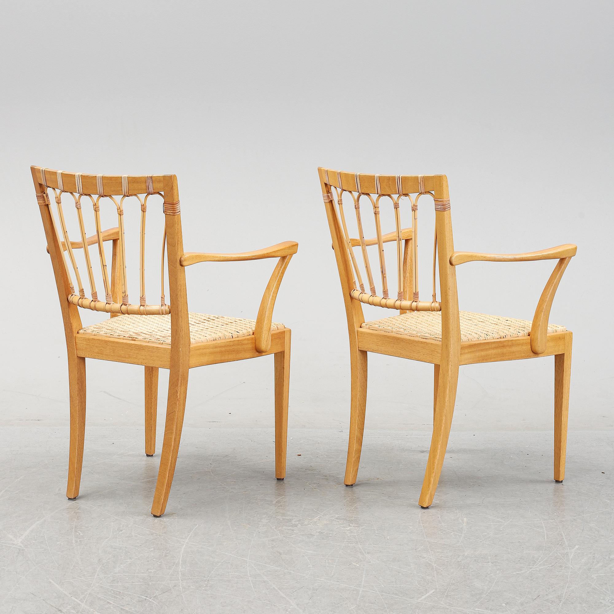 A pair of mahogany armchairs, model 1165, designed by Josef Frank in 1946 for Firma Svenskt Tenn.