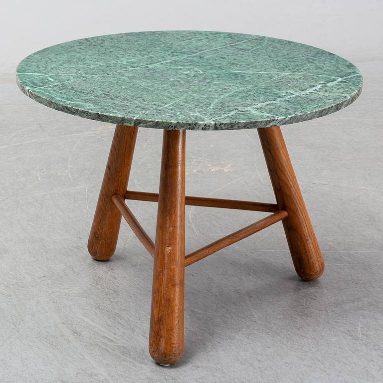 A late 20th century stone and wood coffee table.